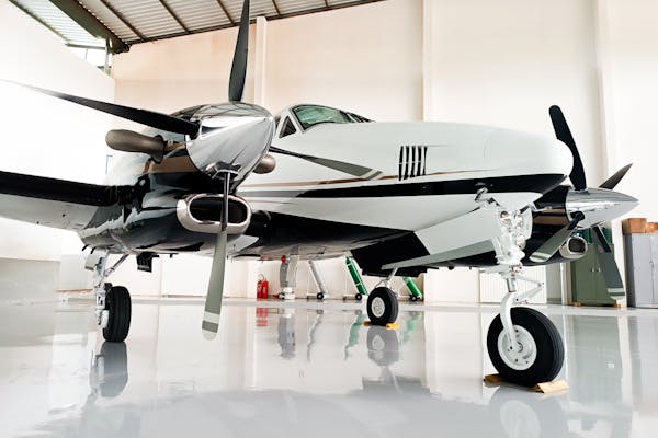 Couple enjoying private dining experience on a secluded beach at sunset